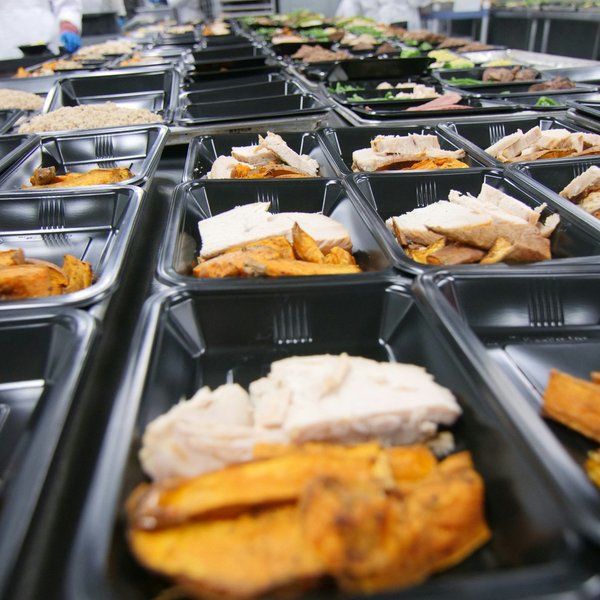 Plastic trays filled with processed foods
