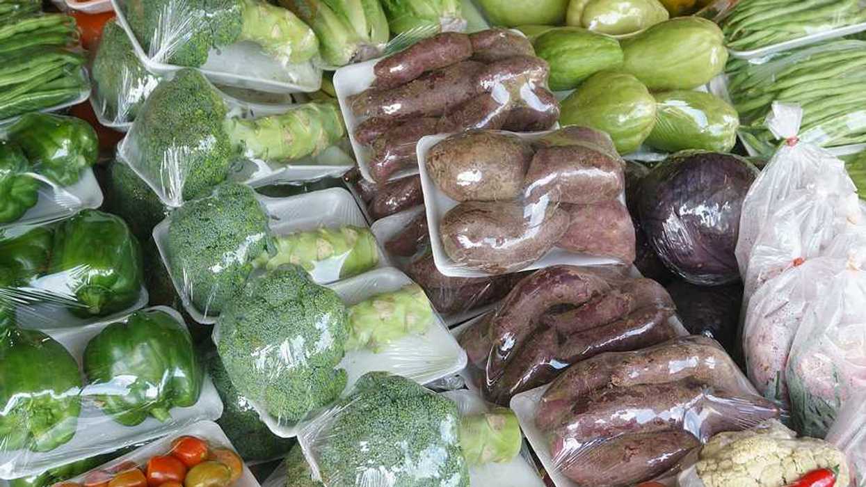 Plastic wrapped vegetables in a grocery store