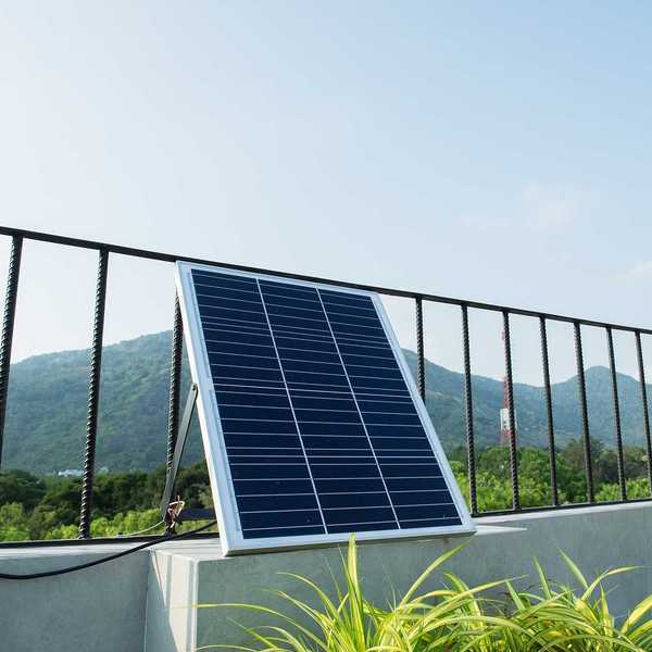 Plug-in solar panels mounted on a balcony terrace.