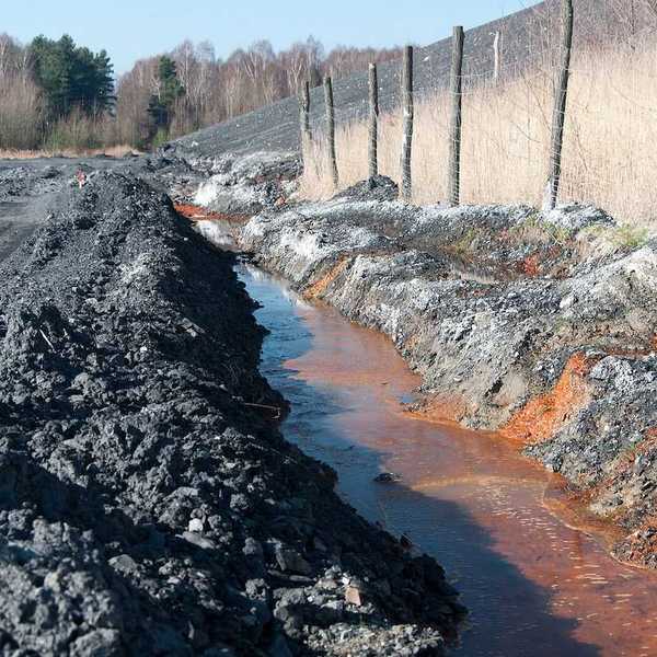 Polluted water adjacent to coal waste heap