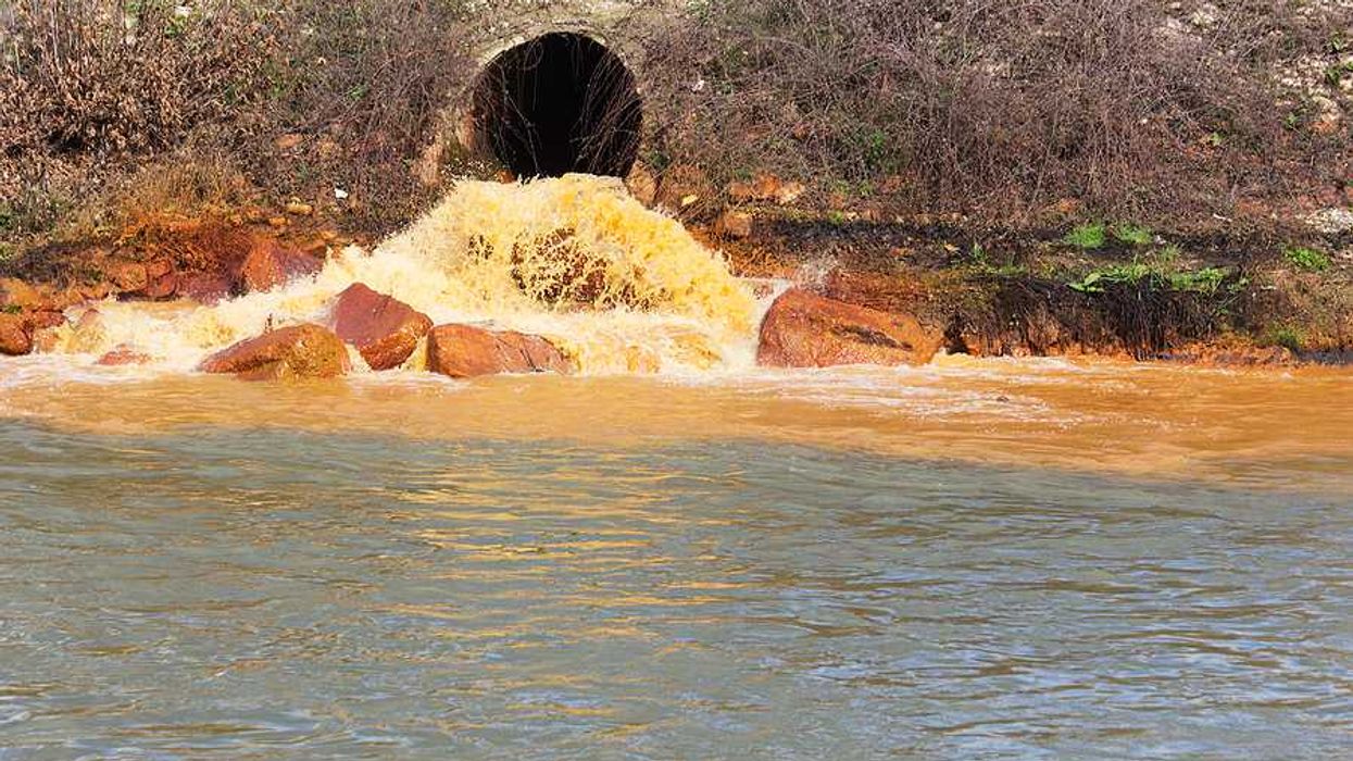 Polluted water coming from a pipe