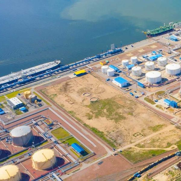 port refinery and petrochemical storage tanks adjacent to ocean