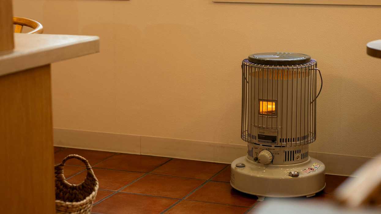 Portable kerosene heater on a tiled floor.