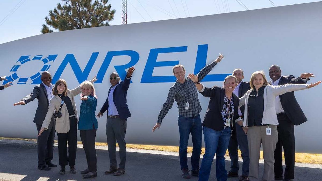 Posing as a wind turbine blade with National Renewable Energy Laboratory (NREL) and Department of Energy (DOE) staff
