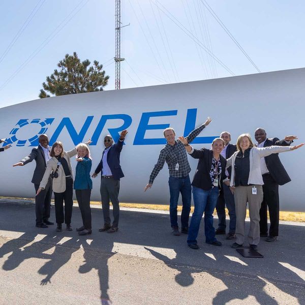 Posing as a wind turbine blade with National Renewable Energy Laboratory (NREL) and Department of Energy (DOE) staff