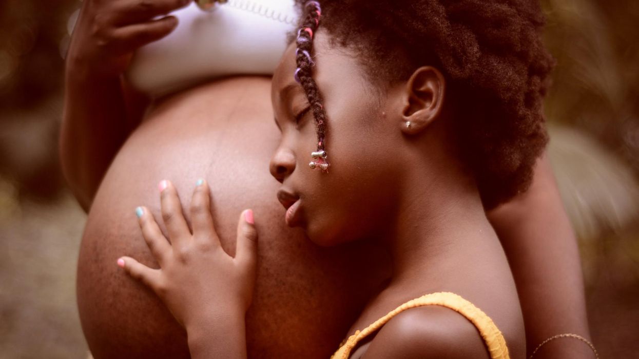 pregnant belly black mother and child