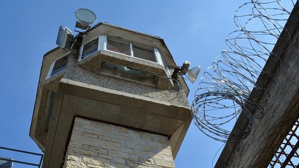 Prison guard tower viewed from below.