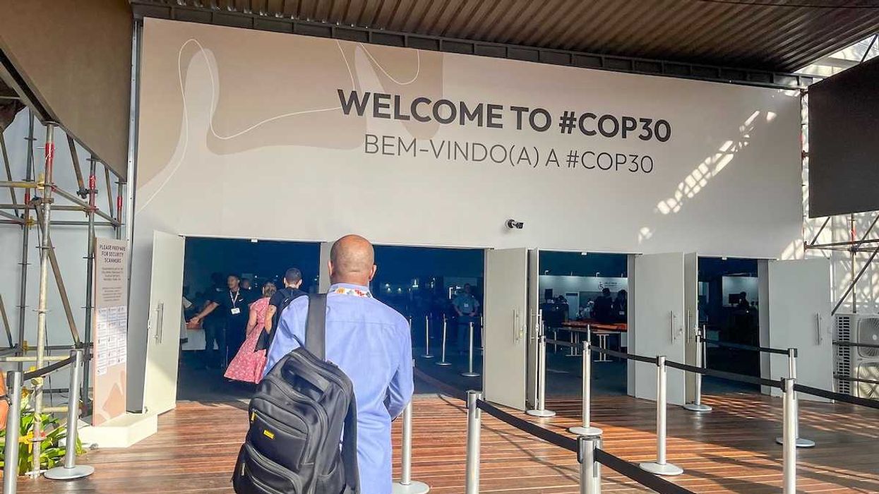 prticipants at the entrance to COP 30 pavilion