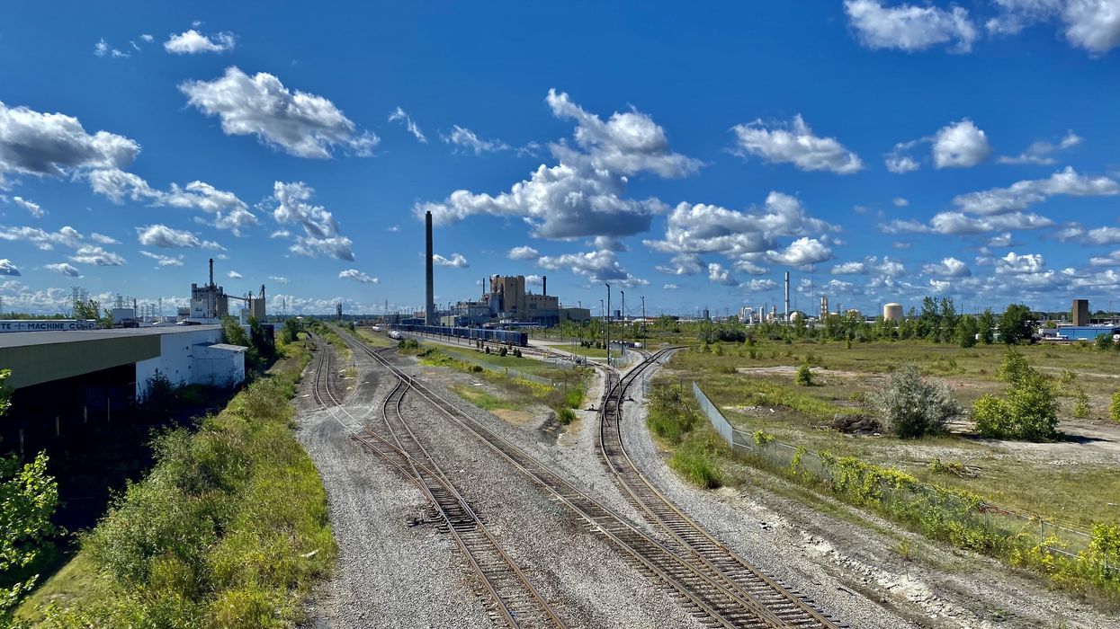 railroad tracks industry clouds sky