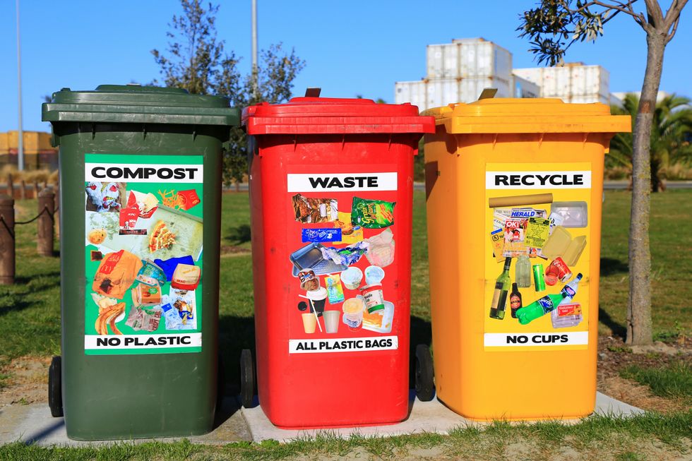 red yellow and green recycling bins.