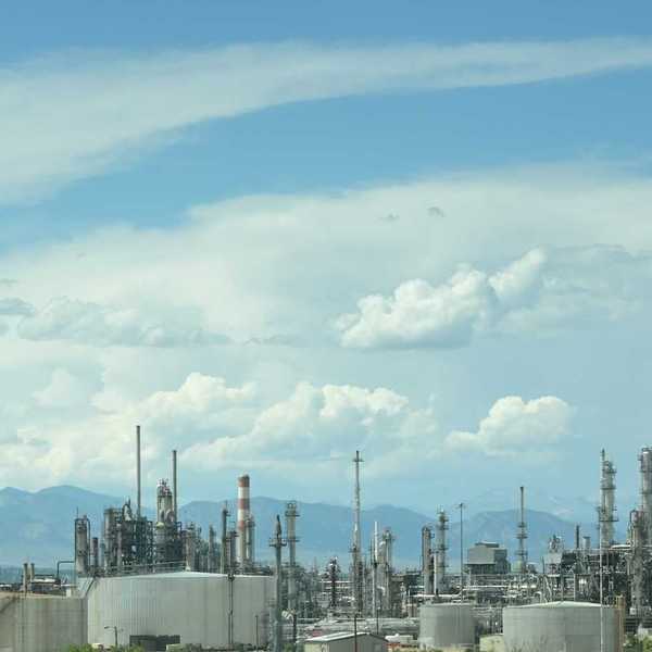 Refinery against a mountainous backdrop
