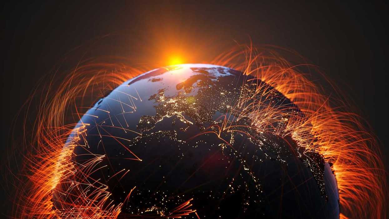 Rendering of planet earth depicting energy pathways against a setting or rising sun