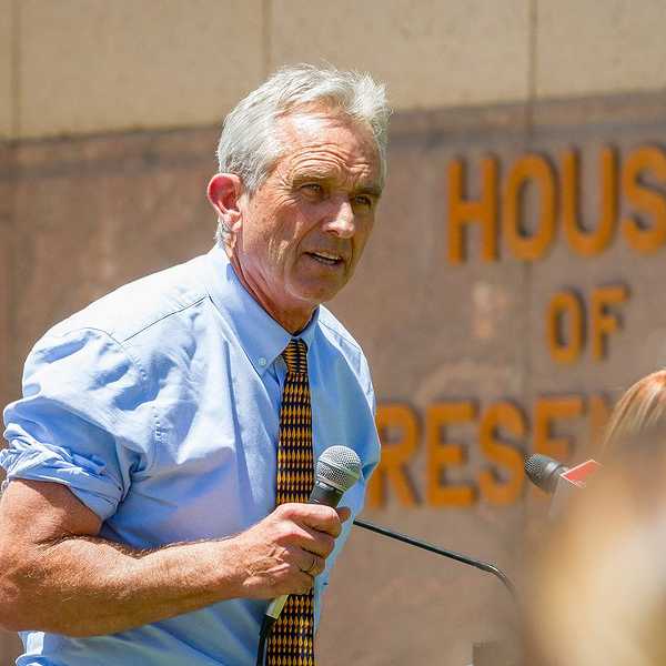 RFK Jr., microphone in hand, speaking