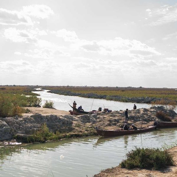 River in Iraq with boats and boatmen