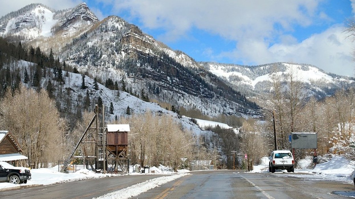 road near snow covered mountains