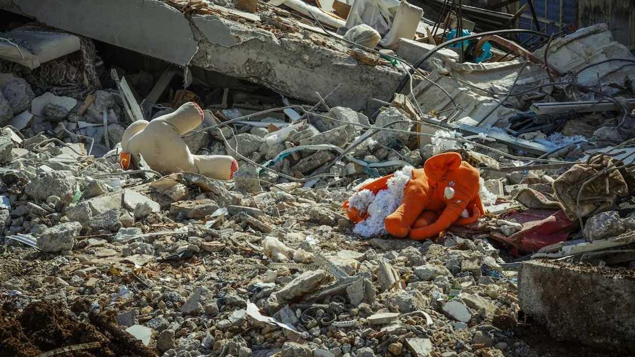 Rubble and stuffed child's toys in the aftermath of a destructive flood