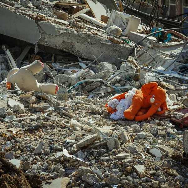 Rubble and stuffed child's toys in the aftermath of a destructive flood