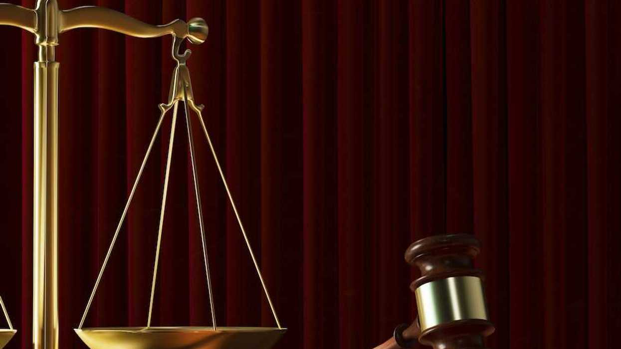 Scales of justice adjacent to a resting judges gavel