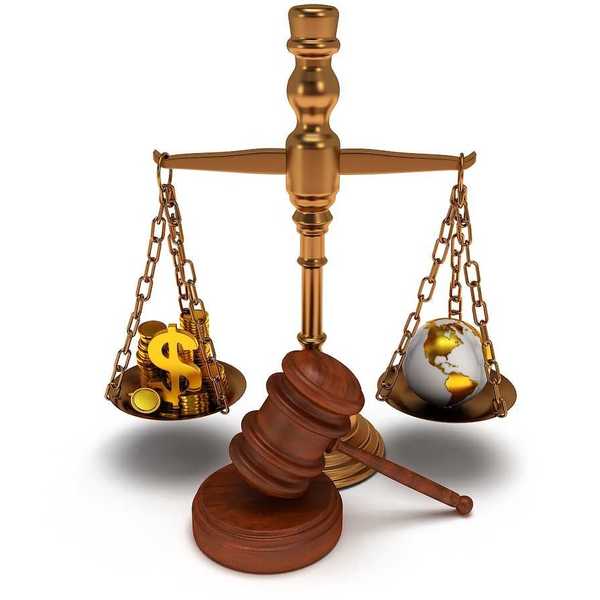 Scales of justice depicting wealth balanced against earth globe.