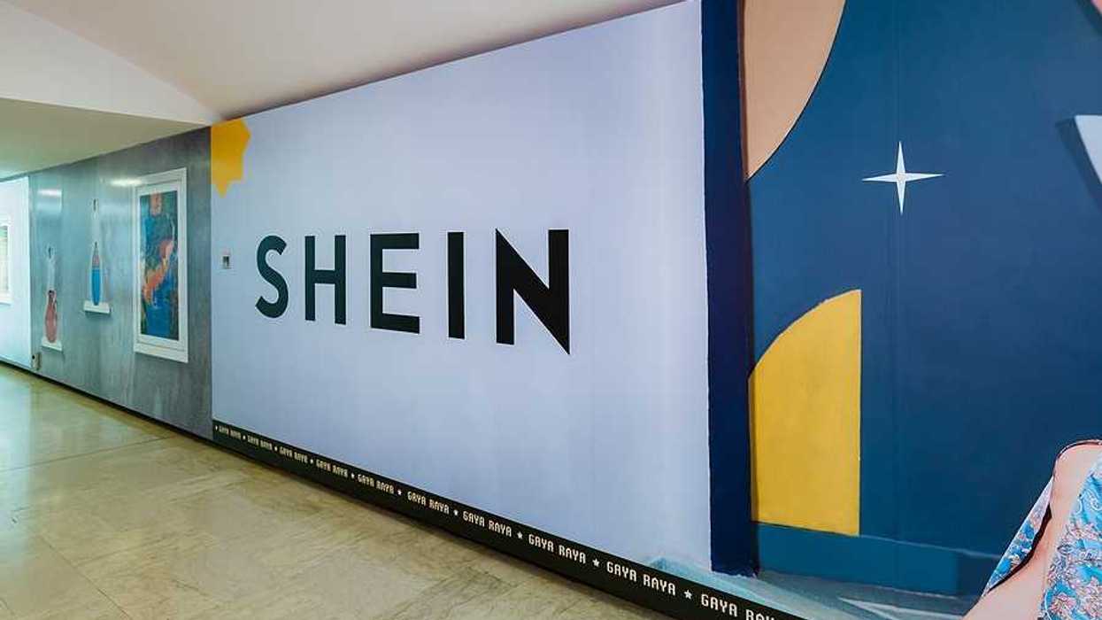 Shein logo on the wall of a subway station