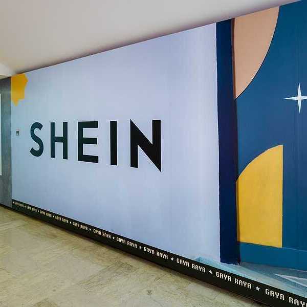Shein logo on the wall of a subway station