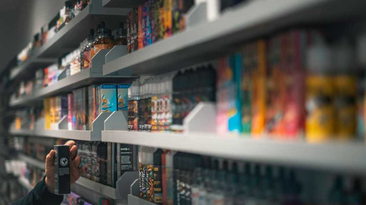 Shelf stocked with various vaping devices and vaping accessories