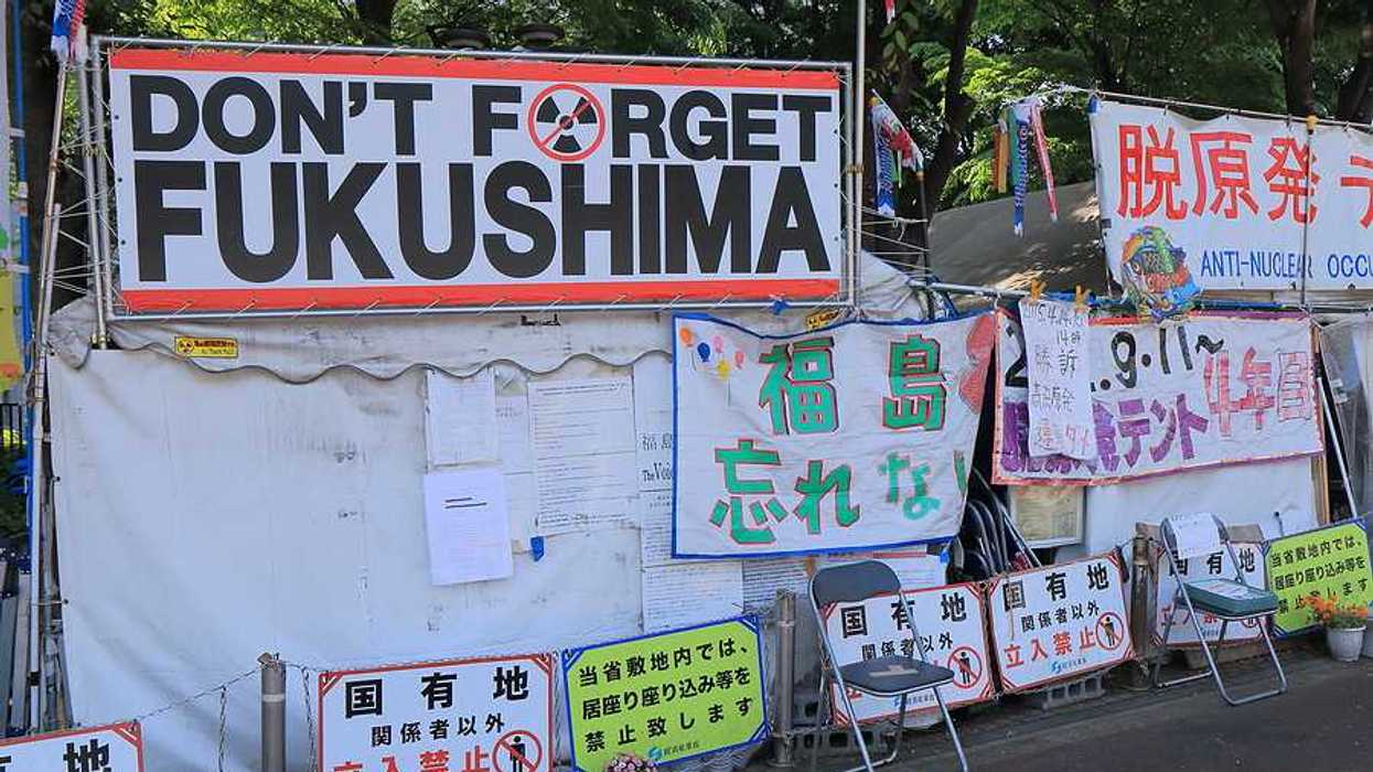 Sign reads "Don't Forget Fukushima." Anti nuclear occupy tent in Japan. Anti nuclear occupy tent pitched near National Diet Building in Nagatacho.