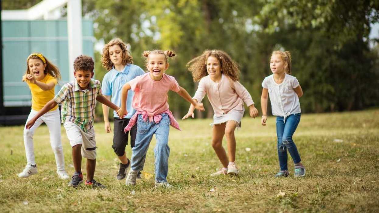 Six children enjoying outdoor open-air play