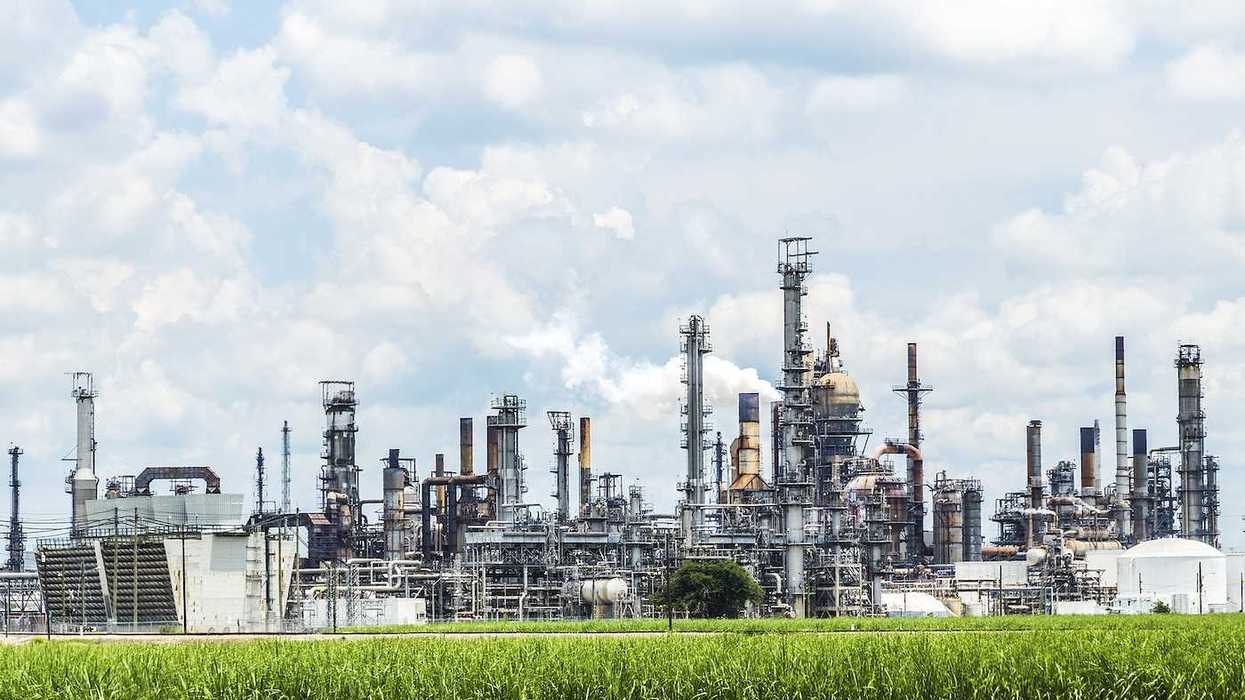 Smokestacks spewing smoke from Convent oil refinery and IMC Agrico Chemical Company in Convent USA.