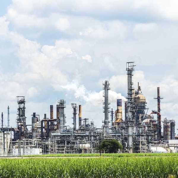 Smokestacks spewing smoke from Convent oil refinery and IMC Agrico Chemical Company in Convent USA