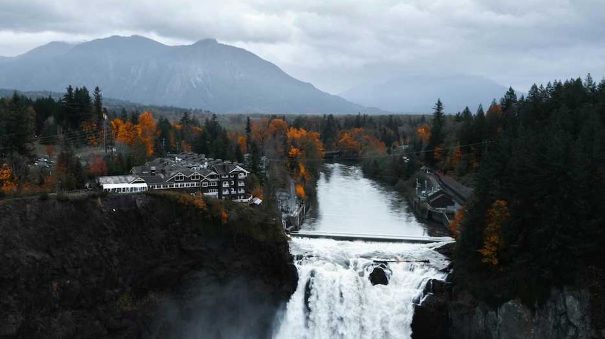Snoqualmie Falls, Snoqualmie, WA, USA with North Cascade Mountains in background