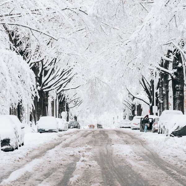 Snowy, slushy street with buried vehicles
