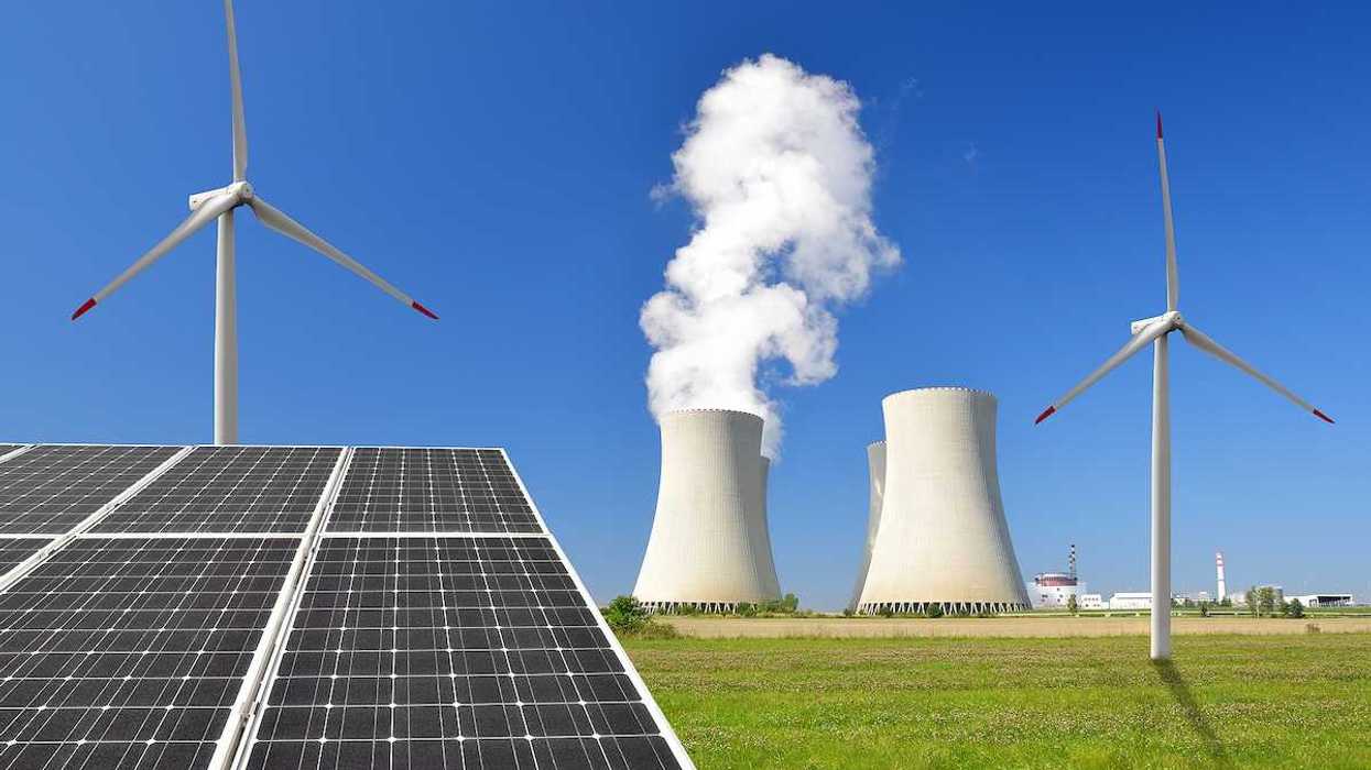 Solar panel, wind turbines and cooling towers from a nuclear power plant