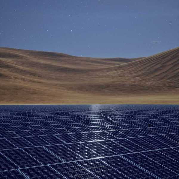 Solar panels in a desert with sand dunes and a starry sky behind