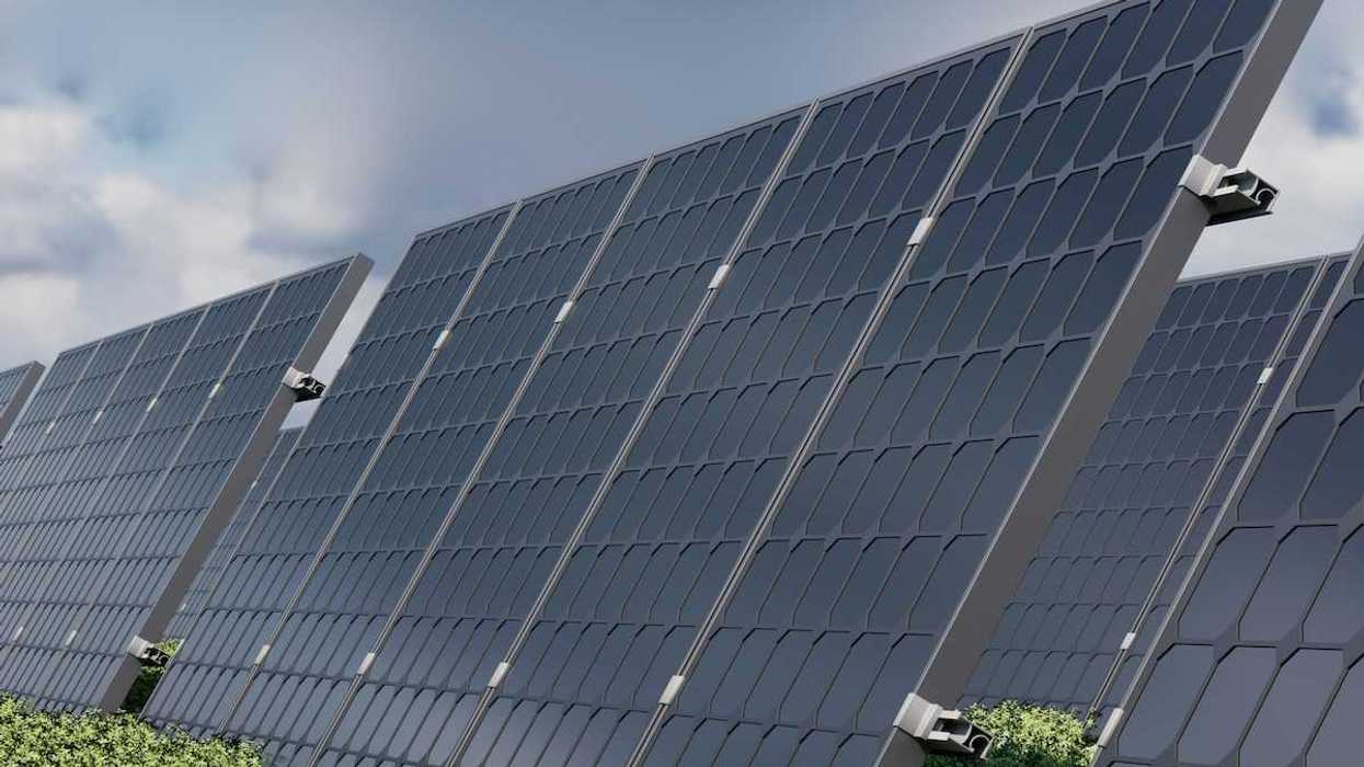 Solar panels under a cloudy sky
