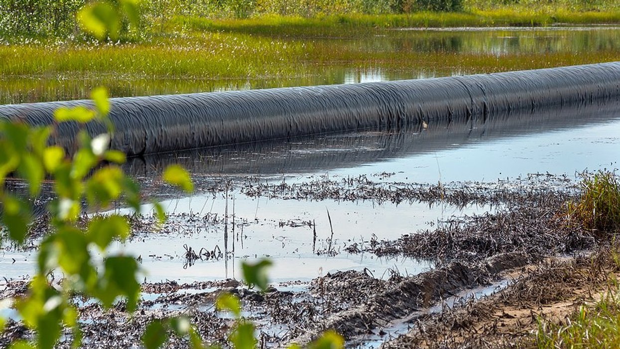 Spilled oil around an oil pipeline.