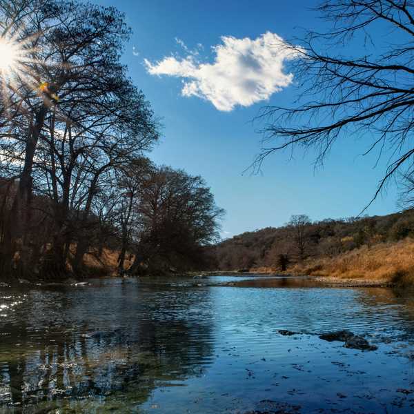 Sunlight shines over river bed