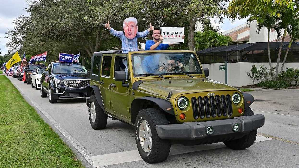Supporters of President Donald Trump parade in cars and trucks in Miami, Florida