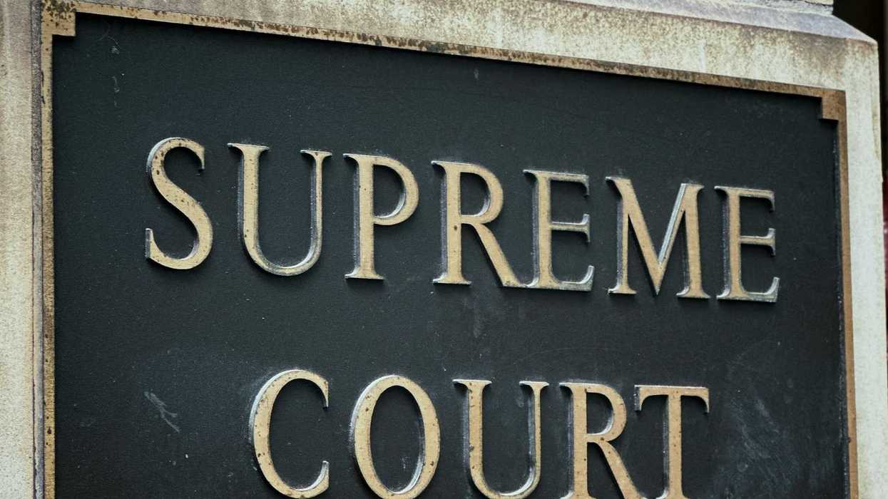 Supreme Court sign - gold letters on a black background