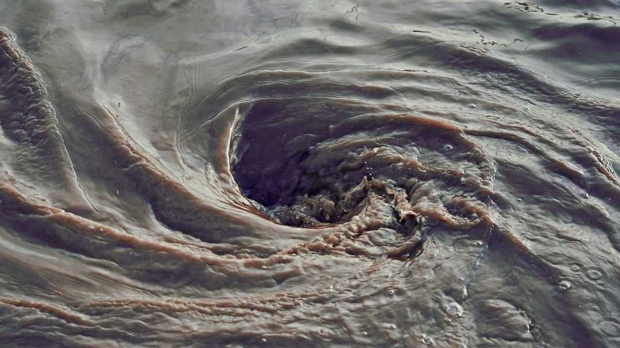Swirling sewage-contaminated water
