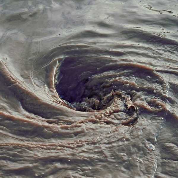 Swirling sewage-contaminated water
