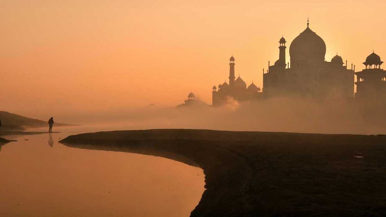 Taj Mahal against a hazy sunrise