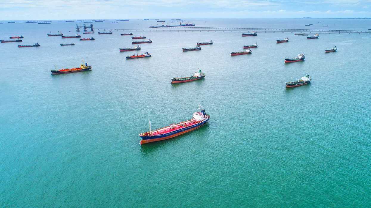 Tankers and cargo ships awaiting port access