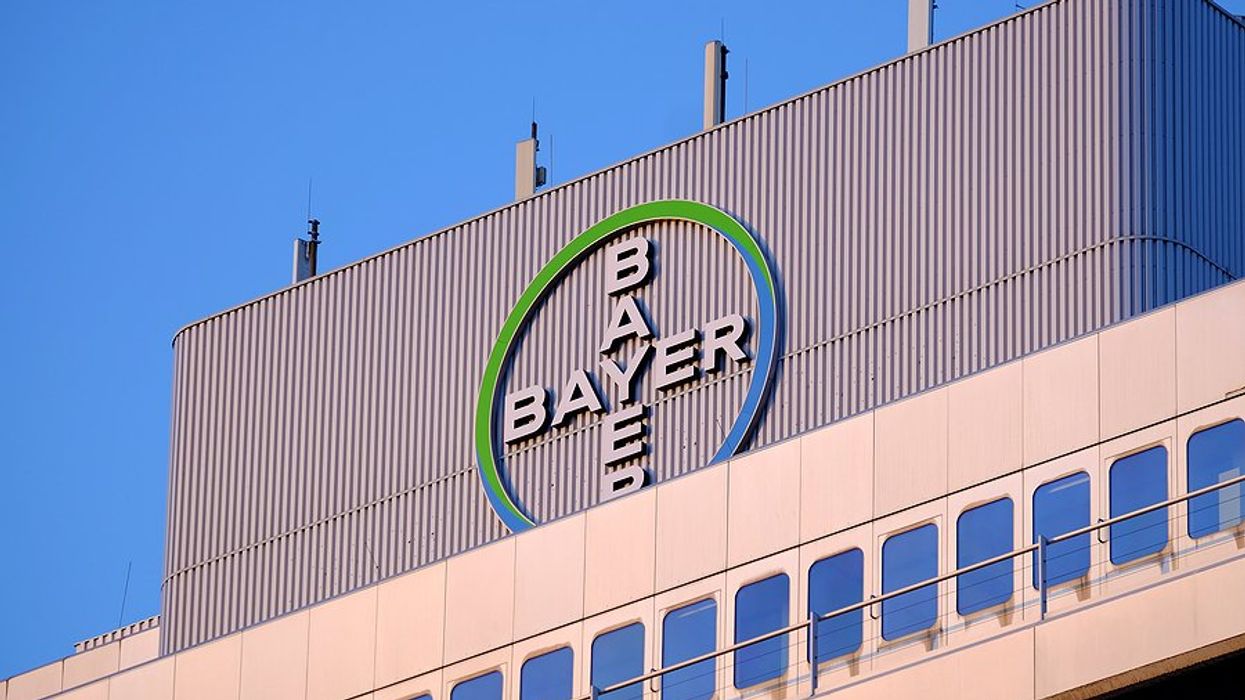 The Bayer logo on the top of a large building.
