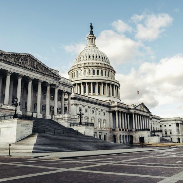 the capitol building in washington dc with blue skies and puffy clouds in the background
