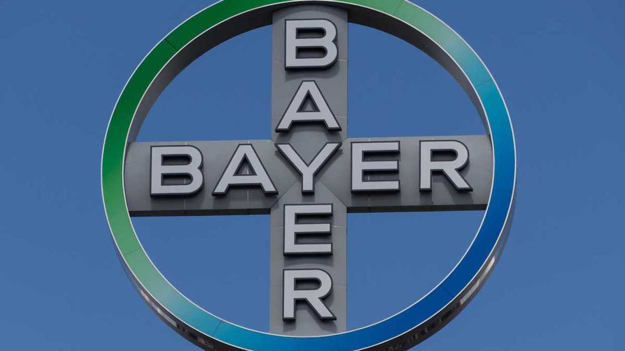 The emblem of Bayer AG, a German chemical and pharmaceutical company.
