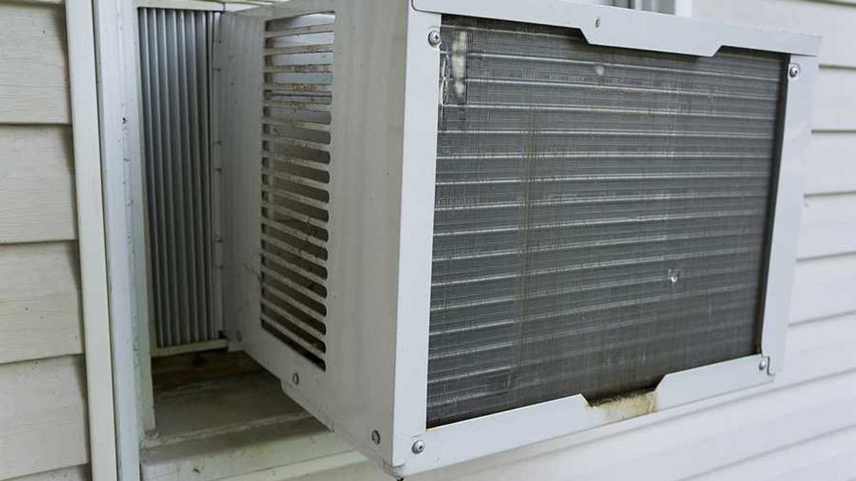 The exterior of a house with a window air conditioner installed