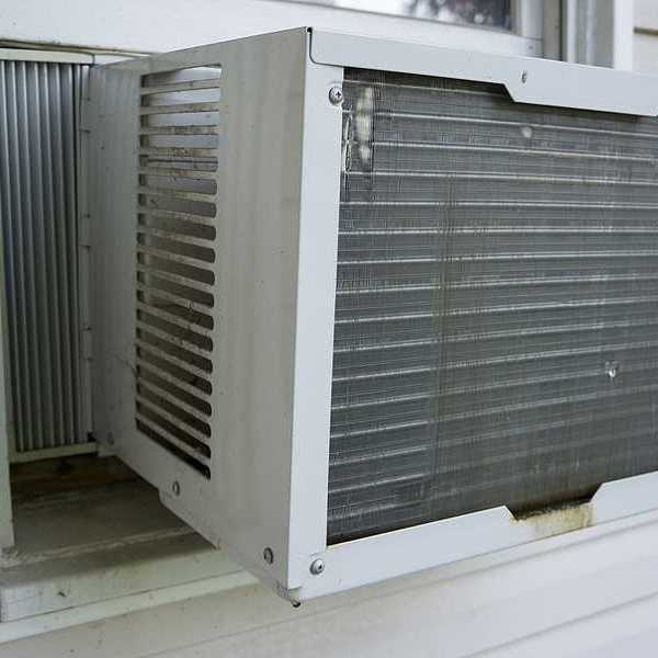The exterior of a house with a window air conditioner installed
