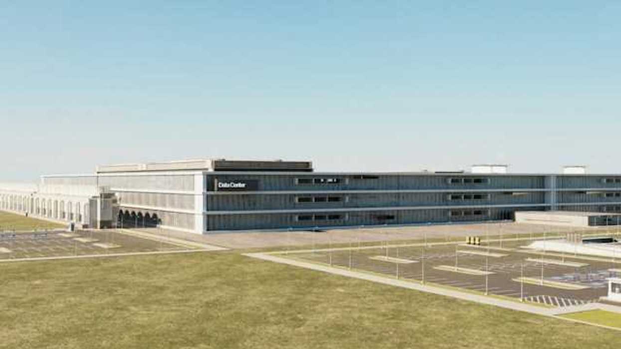 The exterior of a large warehouse type building with a 'data center' sign on the side