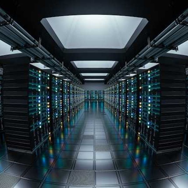 The interior of a data center with rows of servers stretching into the distance